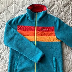 Cotopaxi Blue Fleece Jacket with Multicolor Stripes